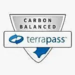 A shield-shaped badge with the words "Carbon Balanced" above the TerraPass logo, featuring blue arrows forming a circle—perfect for any pet lover or mobile dog grooming business committed to sustainability.